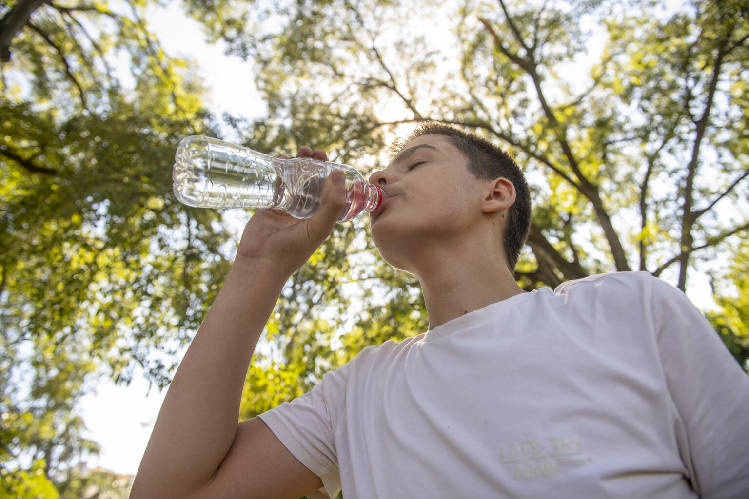 Milan Nikolic 12 drinks water after during sunny day in Serbia