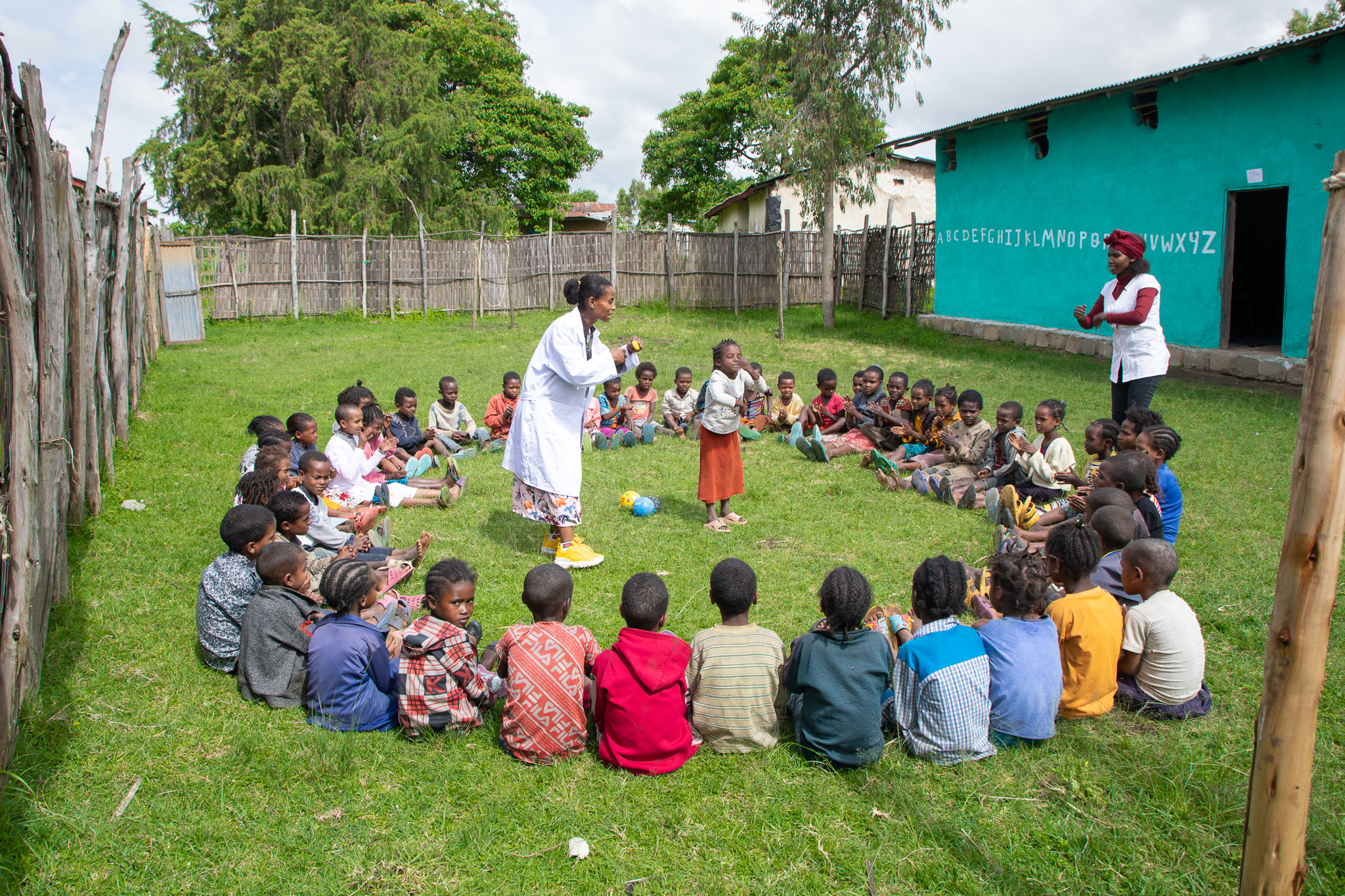 Asnakech Tadesse (L) and Askalech Maloro (R), Preprimary school teachers leading children play session.