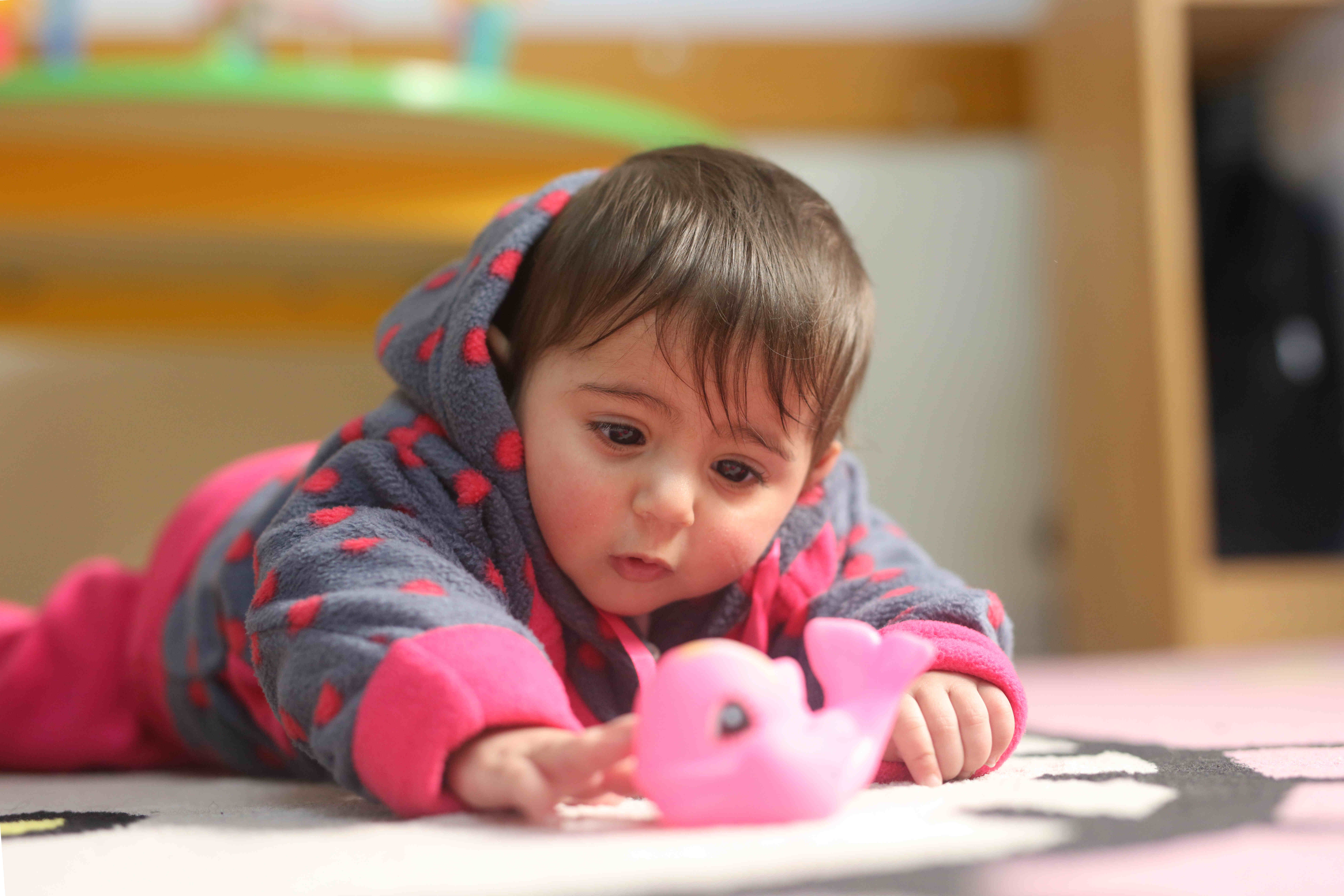 Reeam Aloush, age 18 weeks, attempts crawling in one of UNICEF's Early Childhood Development (ECD) centres in the Sheikh Radwan district, Gaza City, State of Palestine, 22 January 2019. The socio-economic and humanitarian situation in Gaza is dire for children, resulting in increased vulnerabilities and negative coping strategies such as child labour and early marriage. Restrictions on the movement of people and goods into and out of Gaza are negatively affecting trade, employment and supply of services.