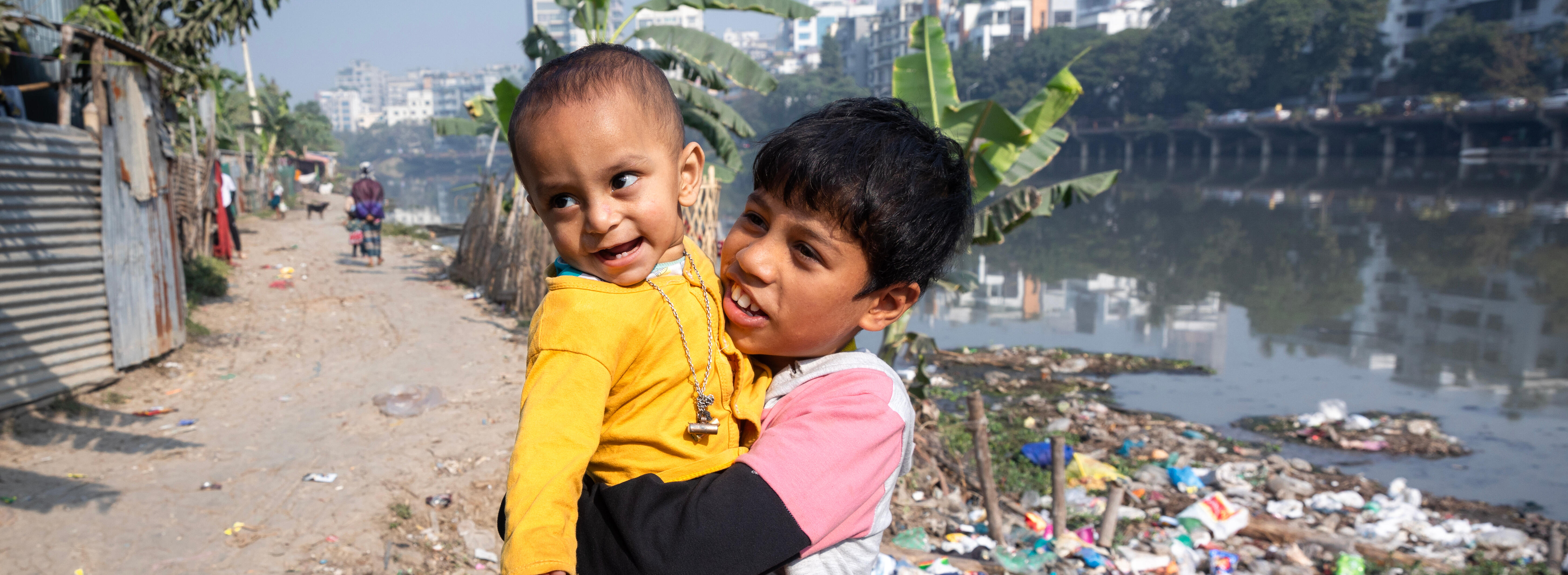 Two brothers, Tamim (10) and Hakeem (02), were photographed near the polluted Banani lake in the Korail slum of Dhaka, Bangladesh on January 28, 2024