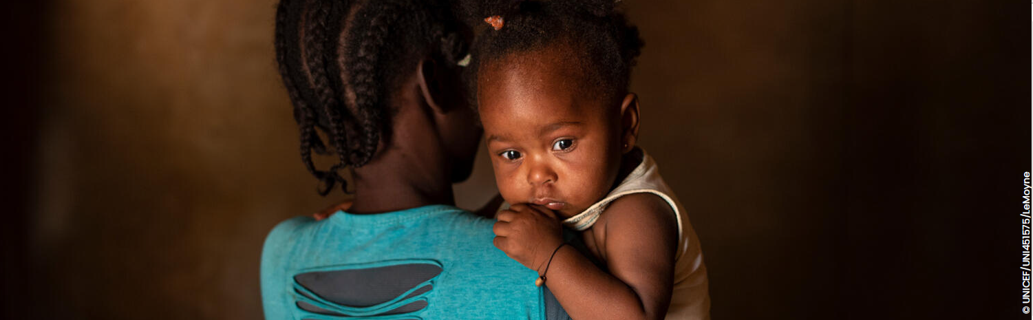 Image of woman holding young children