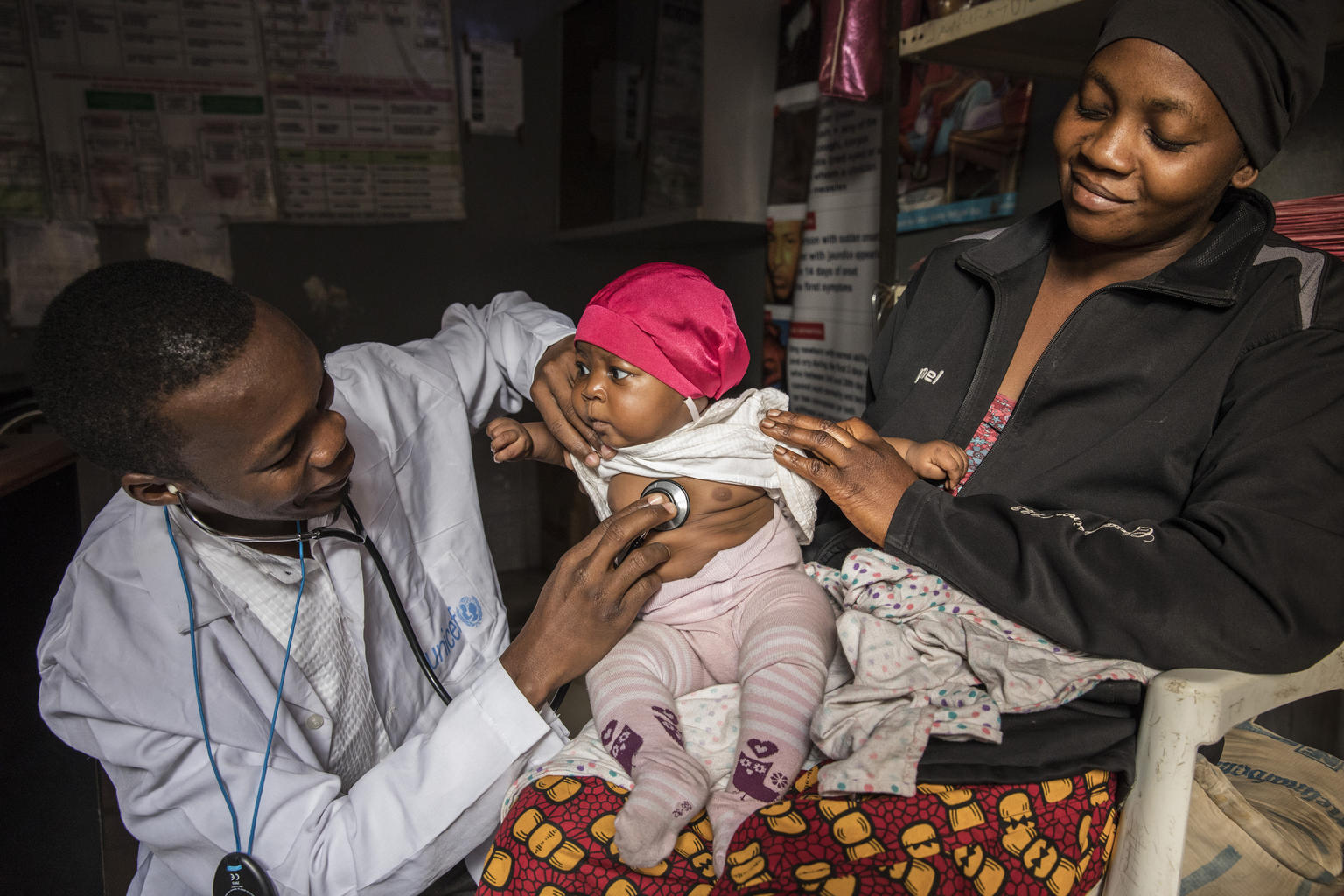A health worker uses a stethoscope while examining one-year-old Beatrice in a health clinic in Yola, Adamawa state, northeastern Nigeria.