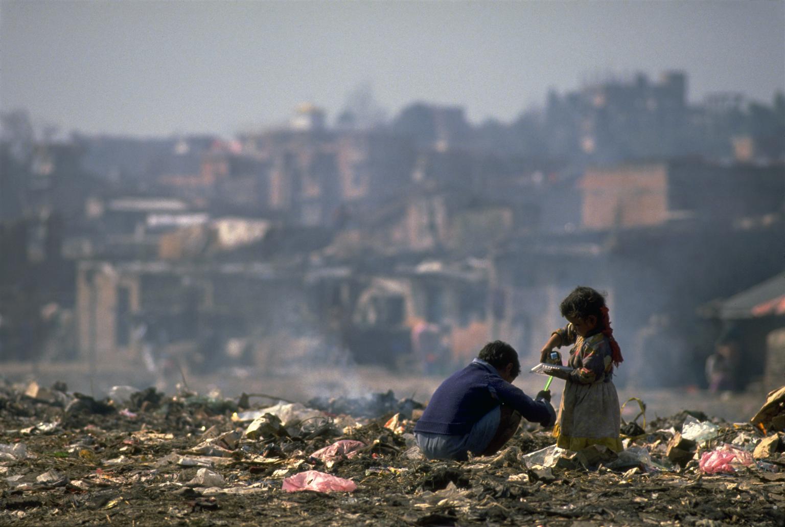 n 1994 in Nepal, children pick through refuse at a garbage dump outside Kathmandu, the capital.