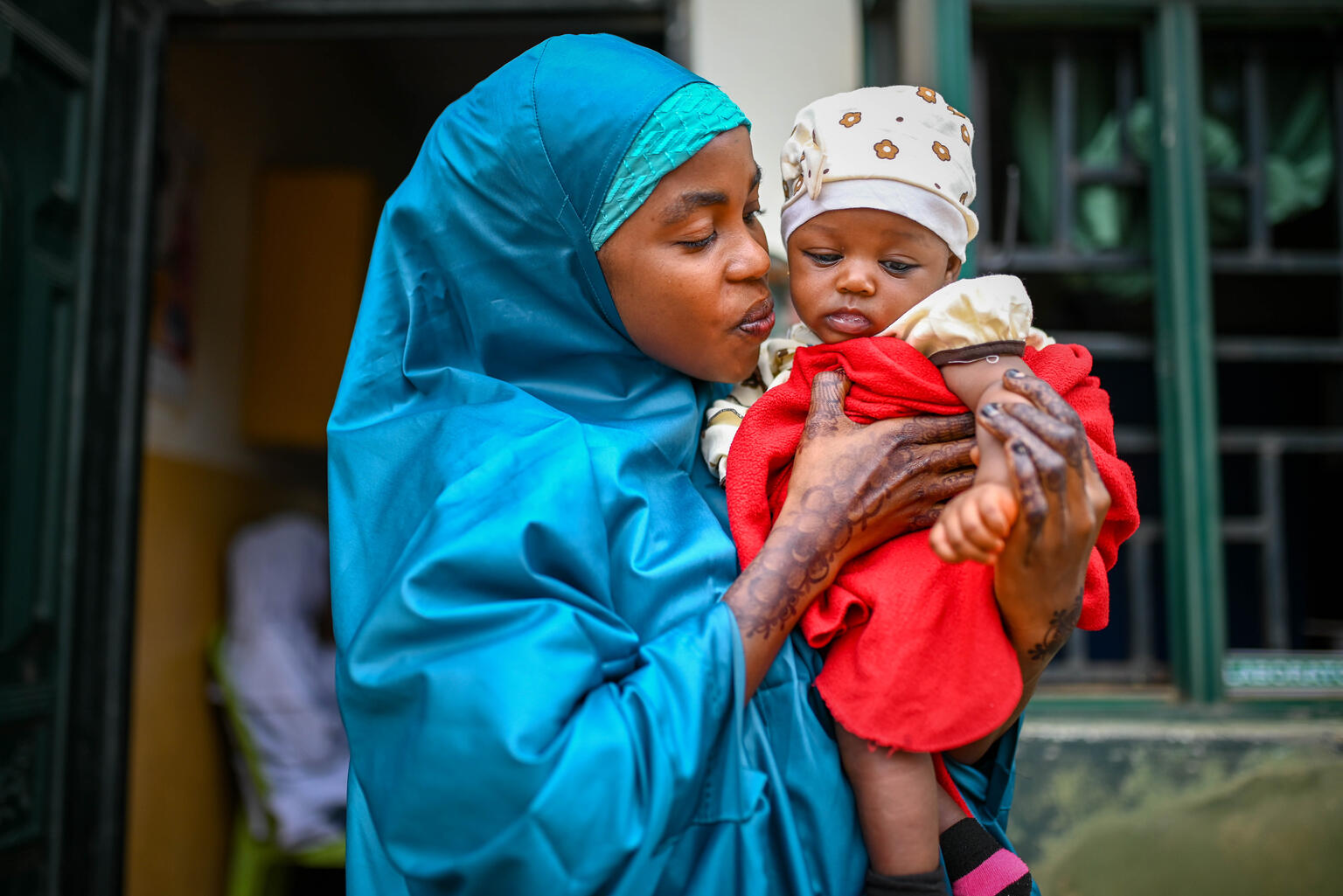 Mother holding infant