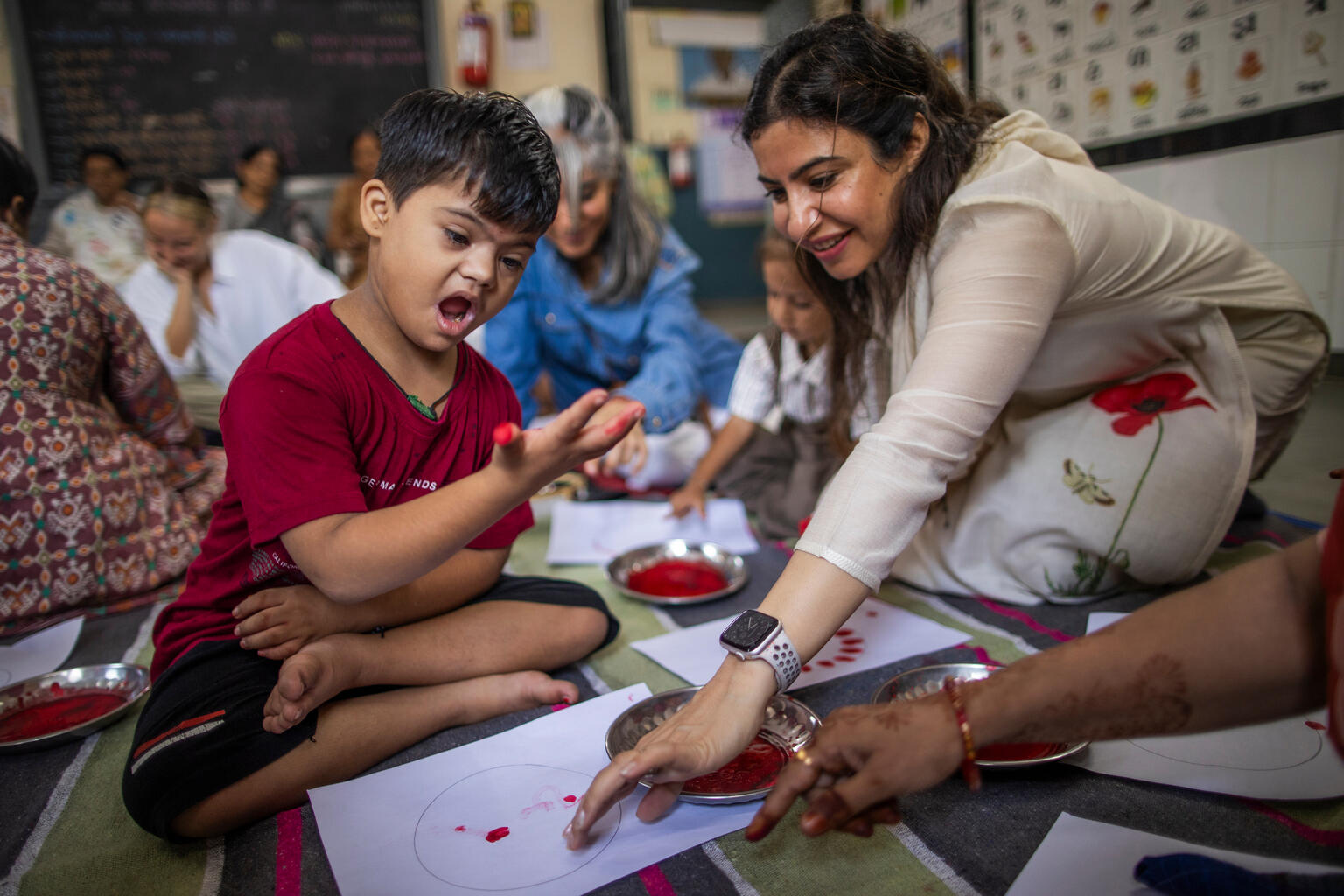 Art be a Part Founder and UNICEF India Champion for Children Medha Nanda, participates in painting activity with 6 year old Modi Vidhi Sachin who has Autism Spectrum Disorder at Bavano Vando Anganwadi Centre.