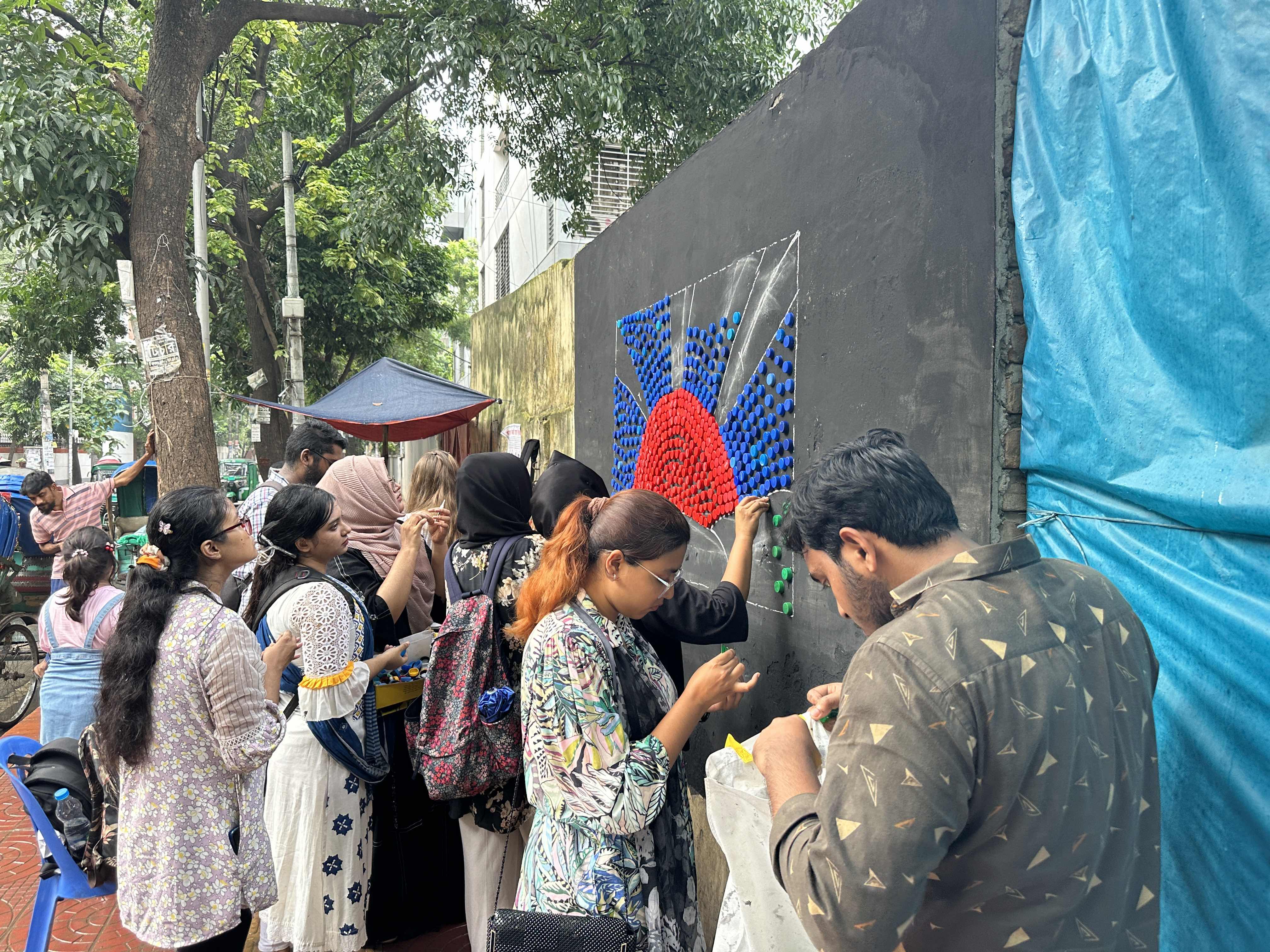 Youths turn plastic waste into art as part of the "Reuse for a Reformed Bangladesh" eco-project.