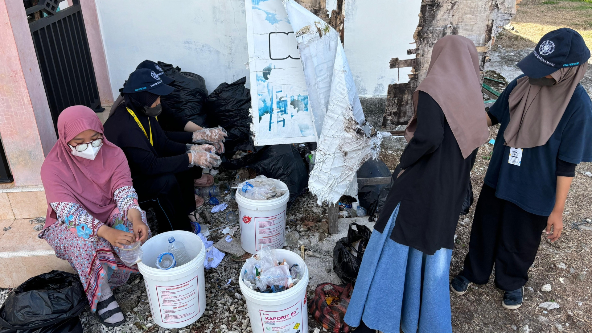 Young girls in Indonesia sort plastic waste.