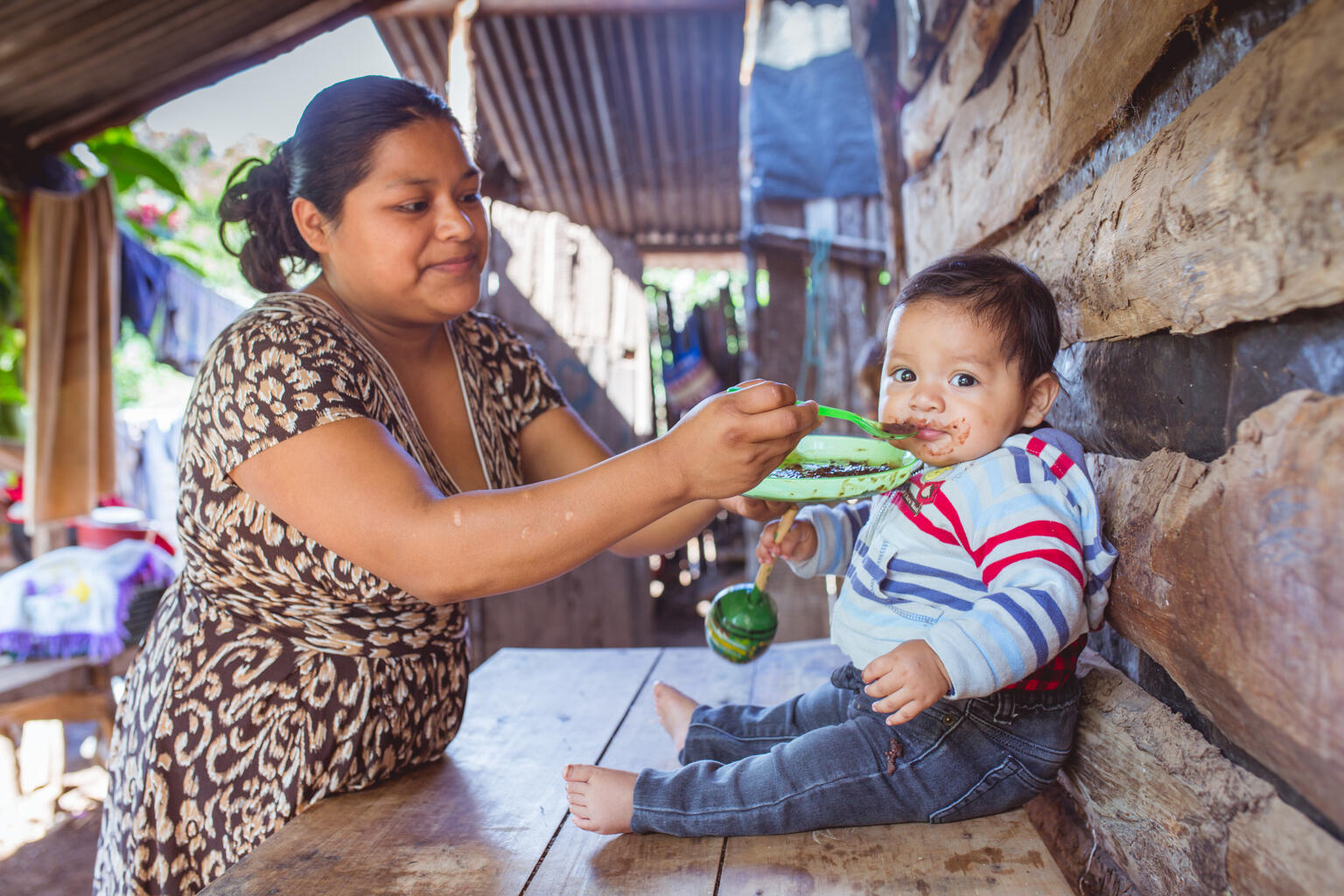 Mother feeds baby in Guatemala.