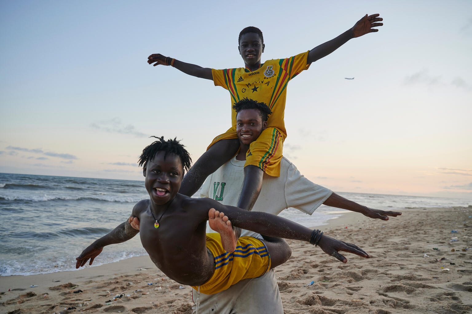 Adolescents perform acrobats on the beach in Labadi Fishing Community in Accra. Ghana